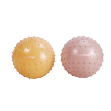 Load image into Gallery viewer, Two textured exercise balls, one yellow and one pink, on a white background.