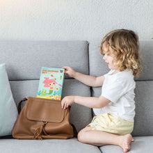 Load image into Gallery viewer, Tiger Tribe Mermaids Colouring Set – lifestyle shot of child with colouring set – the outdoor kid.