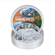 Load image into Gallery viewer, Crazy Aaron's Thinking Putty in a clear container with a scenic lid.