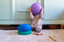 Load image into Gallery viewer, Child with Stapelstein® Original Cool stones during creative indoor play.