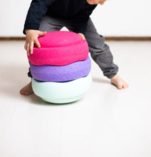 Load image into Gallery viewer, Kid arranging Stapelstein® Mint, Violet & Pink stacking stones during creative play.
