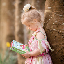 Load image into Gallery viewer, Tiger Tribe Forest Fairies Colouring Set – lifestyle shot of child outdoors – the outdoor kid.
