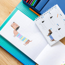 Load image into Gallery viewer, Tiger Tribe How to Draw – Dinosaurs – lifestyle shot of child drawing – the outdoor kid.
