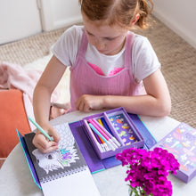 Load image into Gallery viewer, Tiger Tribe Colouring Set – Mystical Forest – lifestyle shot of child colouring – the outdoor kid.
