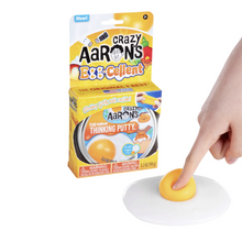 Load image into Gallery viewer, Crazy Aaron's Ex-Cellent Thinking Putty with packaging and a hand holding a piece of putty.
