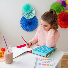Load image into Gallery viewer, Child creating designs with Tiger Tribe Lovely Book of Lettering stationery kit.
