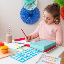 Load image into Gallery viewer, Child creating designs with Tiger Tribe Lovely Book of Lettering stationery kit.
