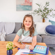 Load image into Gallery viewer, Tiger Tribe Pencil Art – Metallic Blend &amp; Shade – lifestyle shot of child colouring – the outdoor kid.
