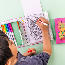Load image into Gallery viewer, Tiger Tribe Scented Colouring – Fruity Cutie – lifestyle shot of child colouring – the outdoor kid.
