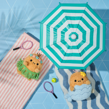 Load image into Gallery viewer, Small plush toy with a striped umbrella on a blue tiled background
