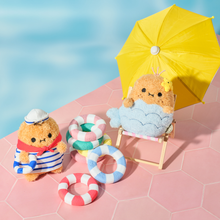 Load image into Gallery viewer, Two plush toys on a pink tiled floor with a yellow umbrella and candy-themed rings.
