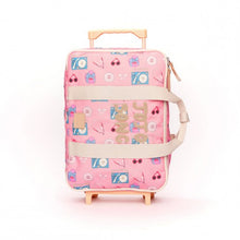 Load image into Gallery viewer, JoJo Factory Song children's suitcase with pink music-inspired print and wheels.

